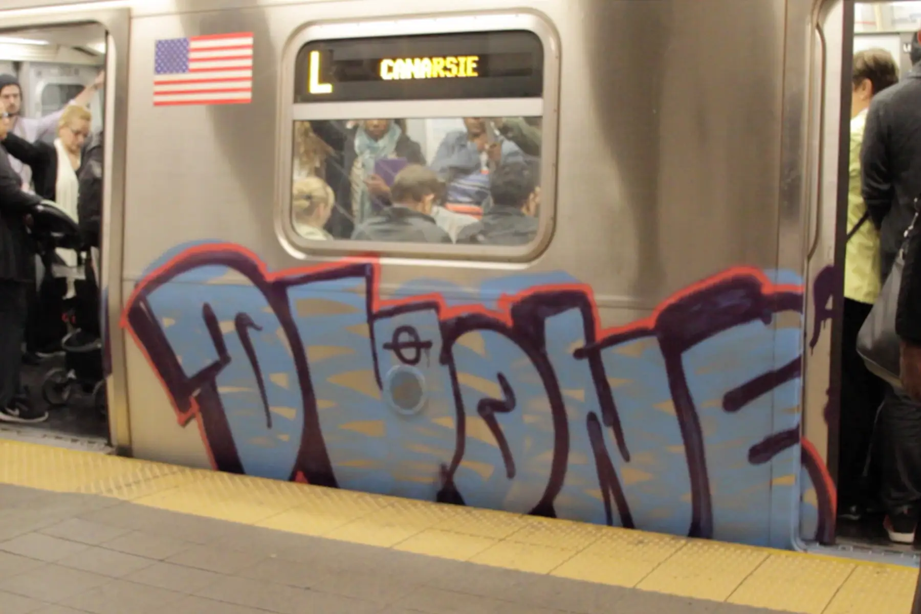 A painted subway car at a New York platform