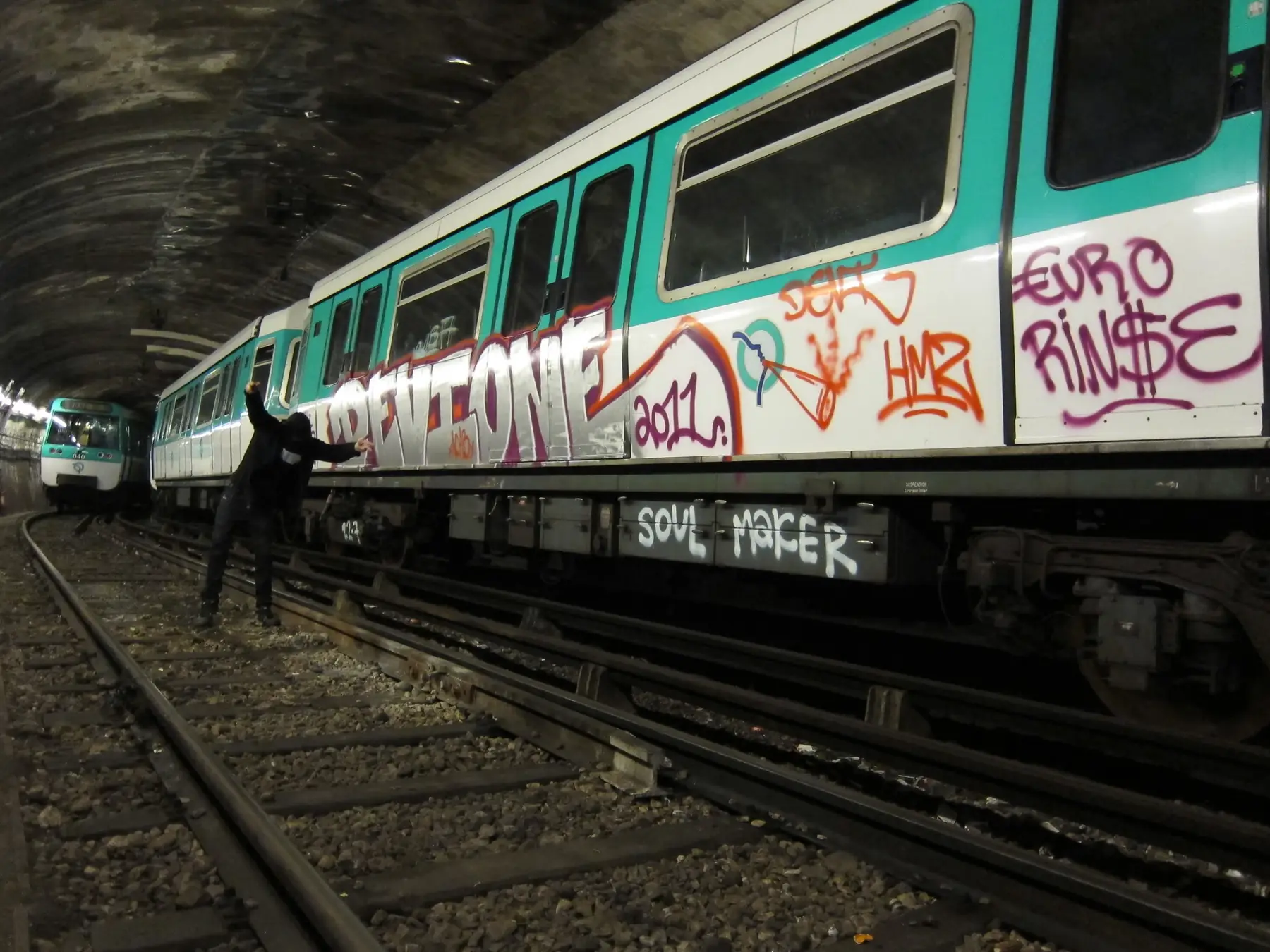 A painted Paris metro train in the tunnel